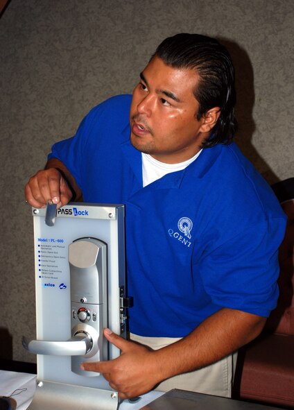 Jared Memo, a technical support representative with QGent, shows visitors the features of some of QGent's security technology at the 5th Annual Sheppard Tech Expo Feb. 27. (U.S. Air Force photo/Airman 1st Class Jacob Corbin)