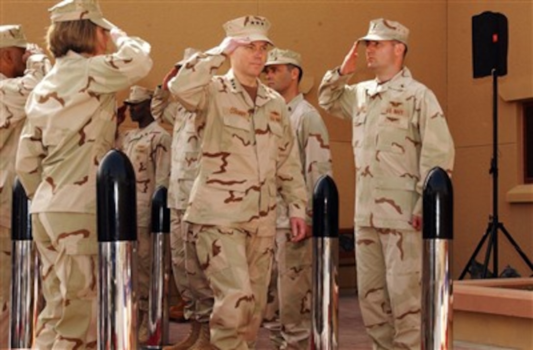 U.S. Navy Vice Adm. Kevin Cosgriff salutes while passing through sideboys during a change of command ceremony at Naval Support Activity, Bahrain, Feb. 27, 2007. Cosgriff assumed command of U.S. Naval Forces Central Command/U.S. 5th Fleet from Vice Adm. Patrick Walsh. 