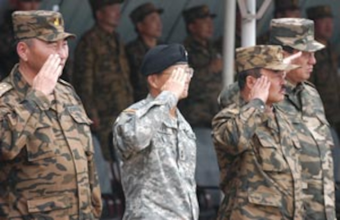 FIVE HILLS TRAINING CENTER, Mongolia (Aug. 1, 2007) ? The senior U. S. Pacific Command representative, Maj. Gen. Vern T. Miyagi, mobilization assistant to the commander of U. S. Pacific Forces, along with distinguished members of the Mongolian Armed Forces review platoons of multinational service members during the opening ceremony of exercise Khaan Quest 07 here Aug. 1. Approximately 1,000 multinational service members converged on the training center here for exercise Khaan Quest 07 to increase their peacekeeping abilities.