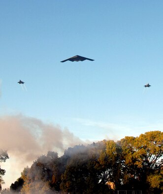 A B-2 Spirit, flanked by two F-22 Raptors, flies over the main parade route during the opening ceremonies of the 118th Rose Parade in Pasadena, Calif., Jan. 1. The aircraft are all from the Air Force Flight Test Center at Edwards Air Force Base, Calif. Participating in the Rose Parade is one of the events helping highlight the Air Force's 60th anniversary in September. (U.S. Air Force photo/Lt. Col. Sandy Burr)