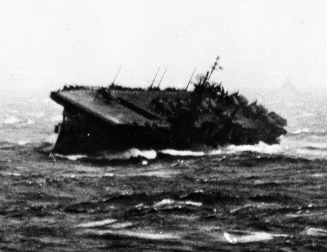 The USS Monterey founders during a typhoon in December 1944. Gerald R. Ford served aboard the Monterey from June 17, 1943, to the end of December 1944. He served as director of physical training, a gunnery officer, and an assistant navigator. Photo courtesy of the Gerald R. Ford Library.