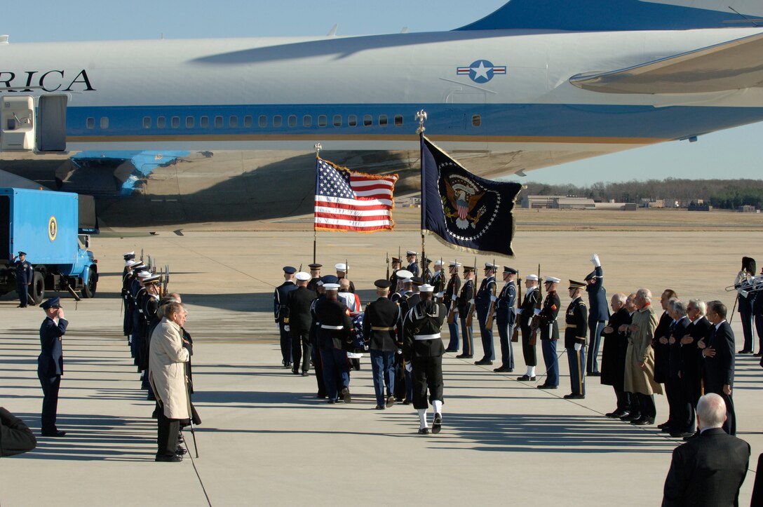 Members of the Ceremonial Honor Guard carry the casket of former President Gerald R. Ford, as Andrews Air Force Base, Md., bids a final farewell to the former President during a military departure ceremony held in his honor. 