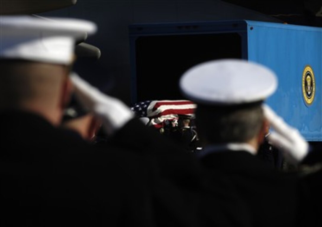 A military honor guard places the casket of former President Gerald R. Ford into an Air Force plane, Jan. 2, 2007, at Andrews Air Force Base, Md. 