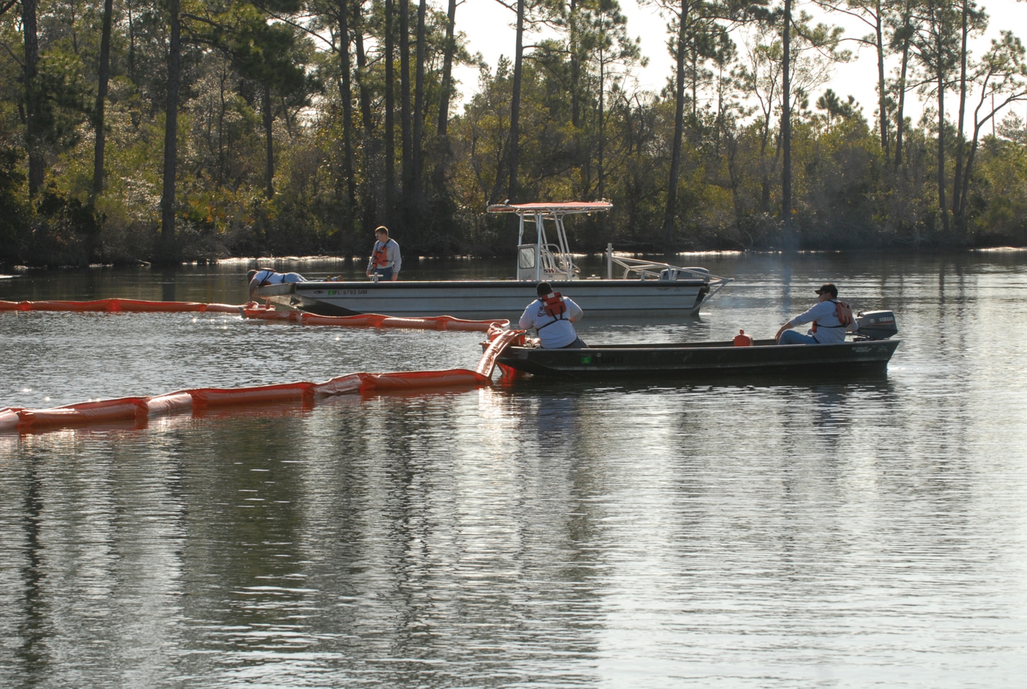 Responders deploy a boom to contain a spill to control its size, impact and protect sensitive habitats.