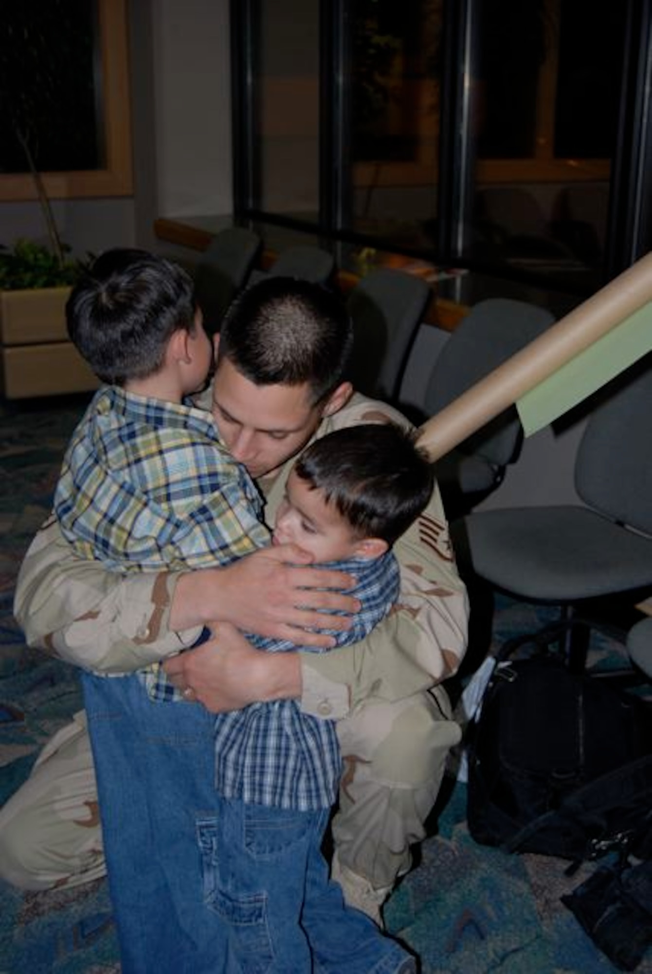 Staff Sgt. James Prim, 28th Civil Engineer Squadron, hugs his sons Diego and Robert, after returning Dec. 22 from a 7-month deployment to Contingency Operating Base Speicher, Iraq. Sergeant Prim was one of 42 28th CES Airmen deployed in support of the continuing global war on terrorism and responsible for maintaining base infrastructure in their overseas location. We left with a big sense of accomplishment, said Sergeant Prim. “I think we put a big dent in the workload, but there’s a lot of work to be done yet.”