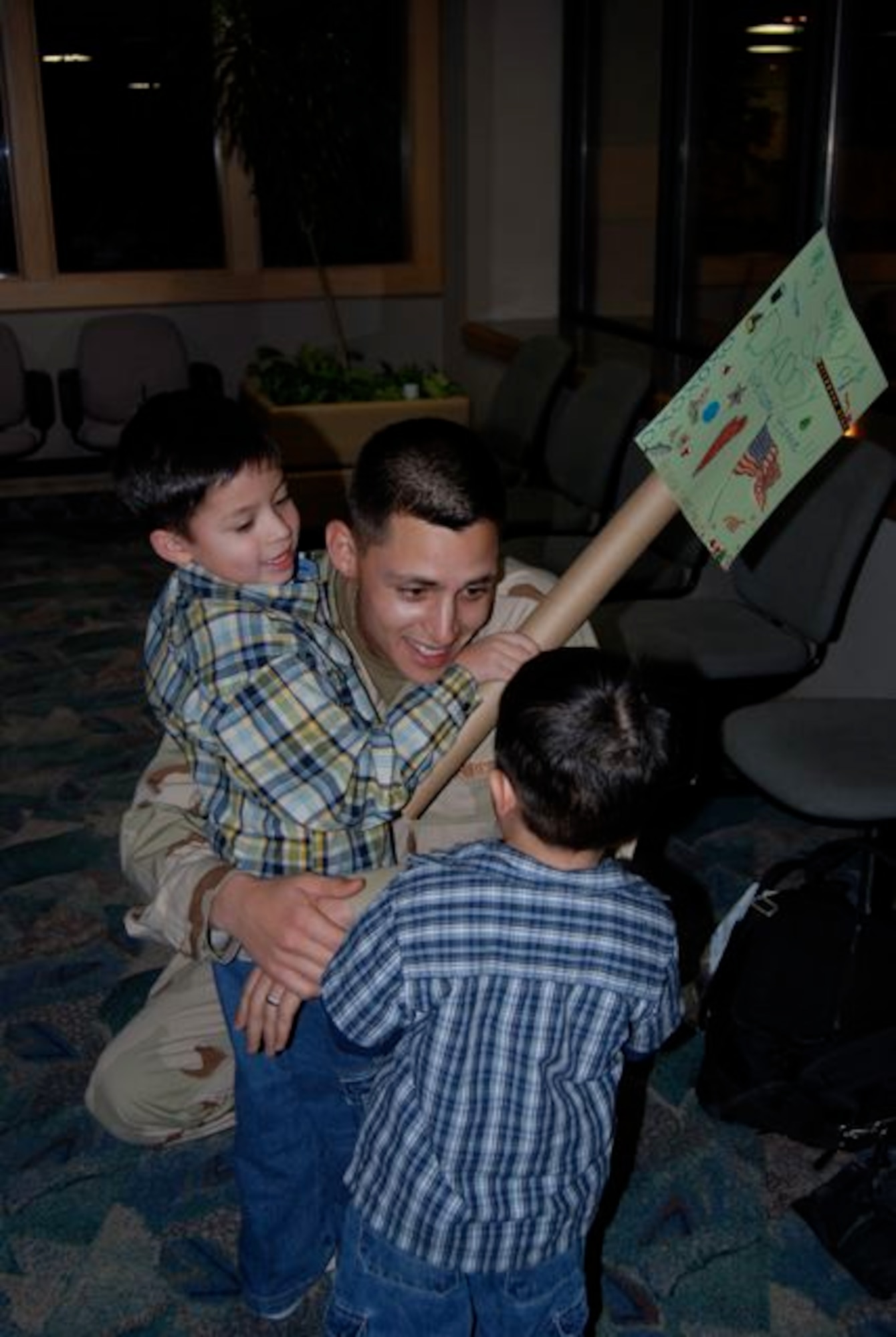 Staff Sgt. James Prim, 28th Civil Engineer Squadron, hugs his sons Diego and Robert, after returning Dec. 22 from a 7-month deployment to Contingency Operating Base Speicher, Iraq. Sergeant Prim was one of 42 28th CES Airmen deployed in support of the continuing global war on terrorism and responsible for maintaining base infrastructure in their overseas location. We left with a big sense of accomplishment, said Sergeant Prim. “I think we put a big dent in the workload, but there’s a lot of work to be done yet.”