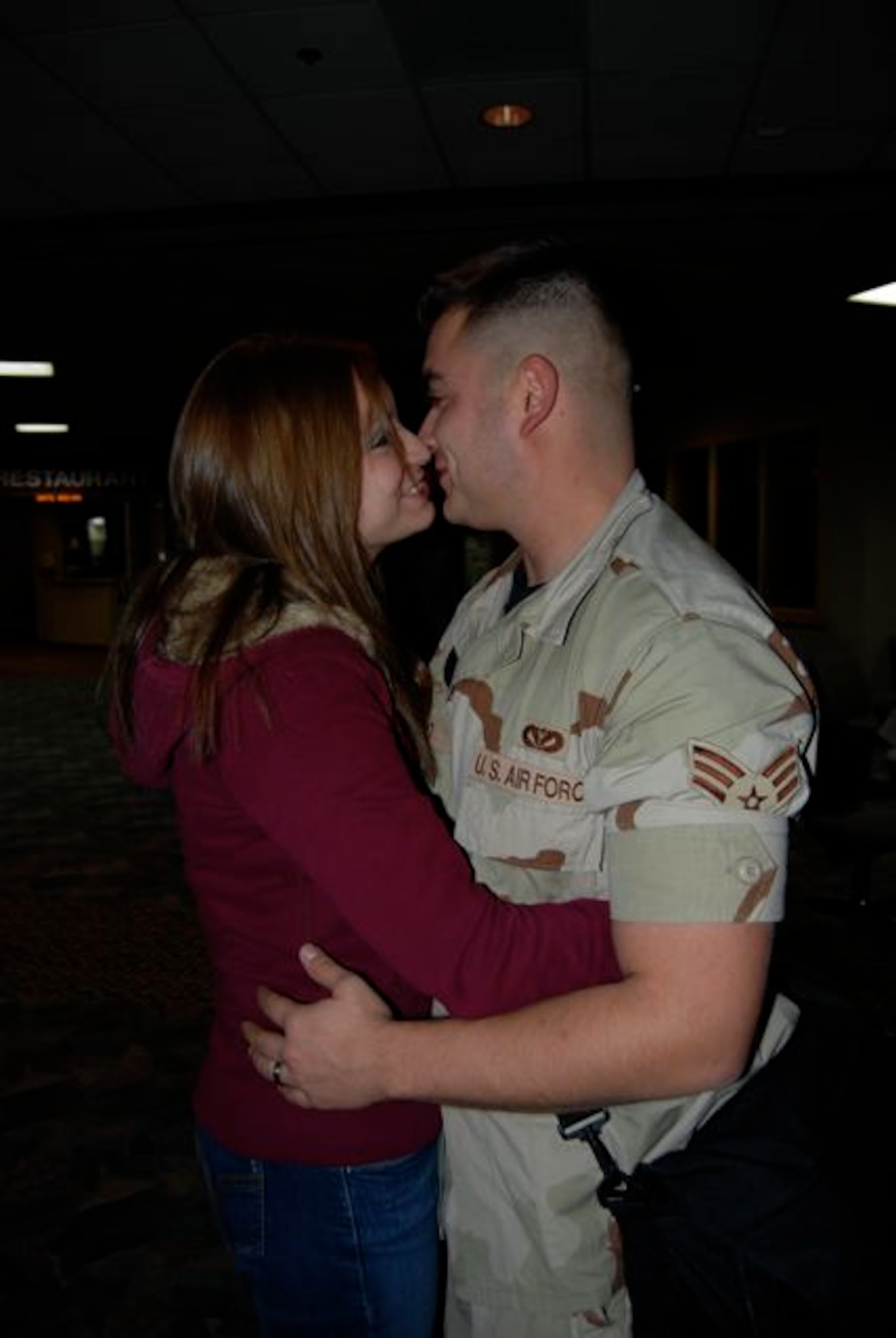 Senior Airman Francisco Salcedo, 28th Civil Engineer Squadron, hugs his wife Amber after returning Dec. 22 from a 7-month deployment to Contingency Operating Base Speicher, Iraq. Airman Salcedo was one of 42 28th CES Airmen deployed in support of the continuing global war on terrorism and responsible for maintaining base infrastructure in their overseas location.