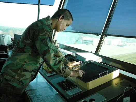 Staff Sgt. Mark Paraoan, 1st Combat Communications Squadron, monitors the lighting control panel in the Air Traffic Control Tower on Ramstein Air Base Dec. 29.  The base air traffic controllers are responsible for monitoring the ILS to ensure all components of the system are working.