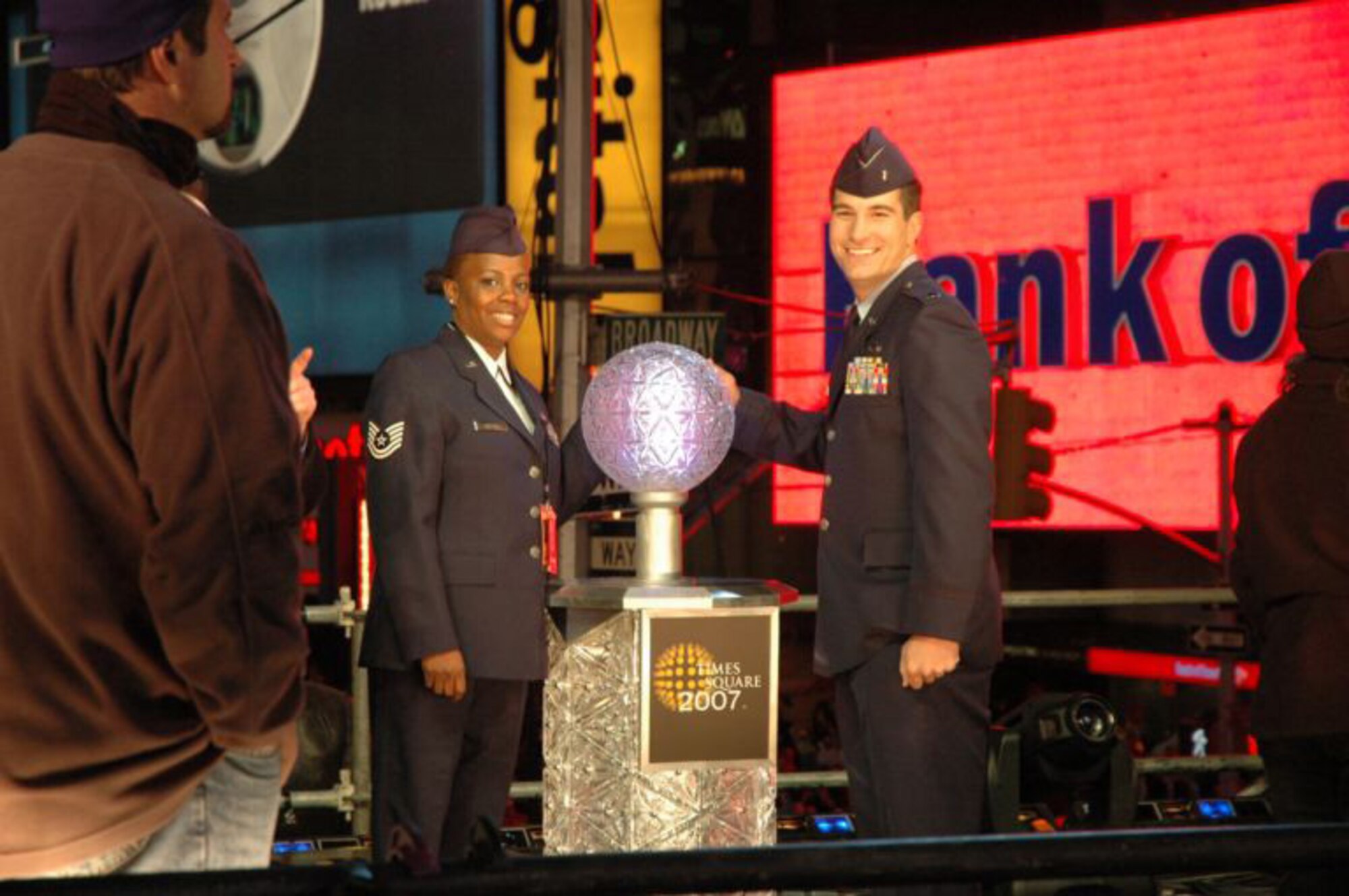 Tech Sgt Sonya Bulluck, Aerial Port Specialist with the Air Force Reserve Command's 514th Air Mobility Wing and 1st Lt. Erick Saks, 305th AMW, McGuire Air Force Base, N.J., pose with the "Big Apple Button" that they helped push to ring in the New Year in Times Square, New York City. The McGuire airmen were selected as honorees of New York Mayor Michael R. Bloomberg.  They joined nine other servicemembers from all branches of the military.  Festivities included helping Mayor Bloomberg push the button to drop the ball at midnight as well as numerous media interviews including a live interview on NBC's Carson Daly show. (U.S. Air Force photo/Senior Airman Rachel Bernardez)

