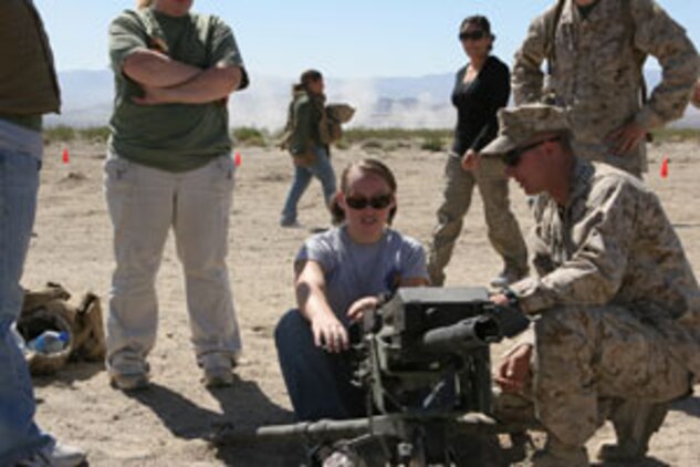 Ashley Lopez-Gonzales tries to practically apply her knowledge of the MK19 40mm grenade launcher at the Combat Center?s Range 500 during the 1st Tank Battalion Jane Wayne Day Oct. 4.