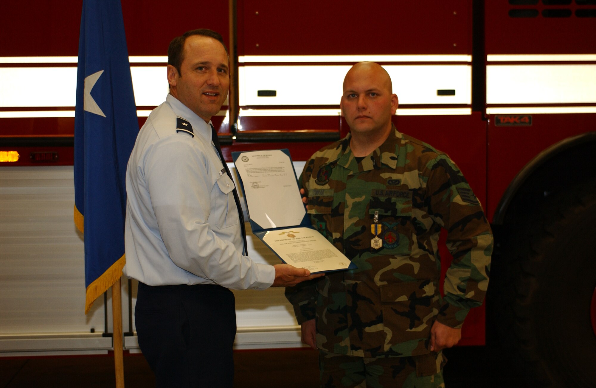 Staff Sgt. Darrell Tirpak, 56th Civil Engineer Squadron firefighter, was awarded the Air Force Commendation Medal by the 56th Fighter Wing Commander, Brig. Gen. Tom Jones Dec. 29, 2006.