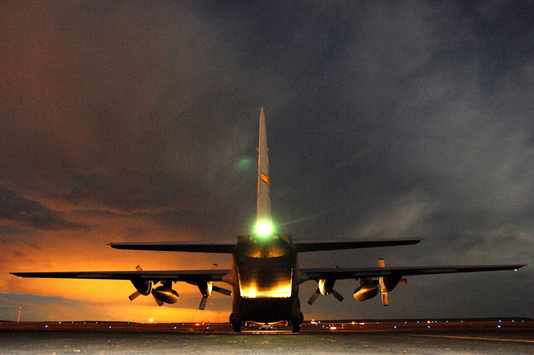 A Wyoming National Guard C-130 Hercules from Cheyenne prepares to depart Jan. 3 from Pueblo, Colo., after being loaded with six one-ton bales of hay. The hay is intended for cattle stranded by a winter storm in southeastern Colorado. The aircraft was loaded in the evening after the last drop of the first day so it would be ready to go early on the second day. It would land again at Pueblo for more missions and drops as time and weather permitted. (U.S. Air Force photo/Senior Master Sgt. John Rohrer)