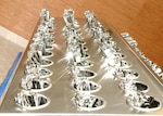 Silverware glisten in their trays on opening day of the new dining facility on the Lackland Training Annex at Lackland Air Force Base, Texas. The dining facility mainly serves technical students and instructors from the 342nd, 343rd and 344th Training Squadrons, and members of the 90th Intelligence Squadron. The facility can hold up to 1,500 diners, has four serving lines and three dining areas, and has modern lighting and wooden floors. Construction of the dining facility, which replaced the 35-year-old Medina Inn, is among $60.3 million in major building projects scheduled for opening early this year.