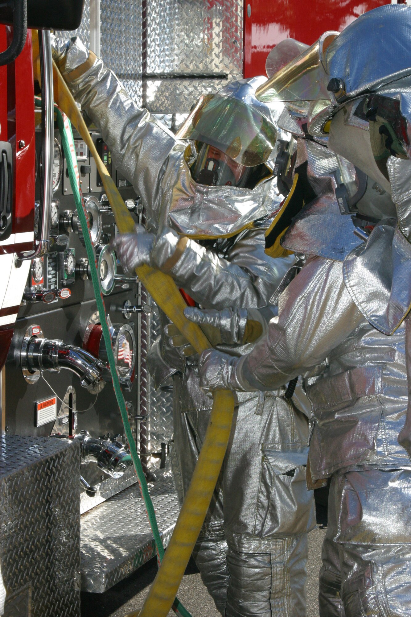 Airmen from the 43rd Civil Engineer Squadron fire department respond to a simulated fire by the fire pit. The Airmen were evaluated on their ability to respond and operate during the base's Operational Readiness Exercise Dec. 14.
