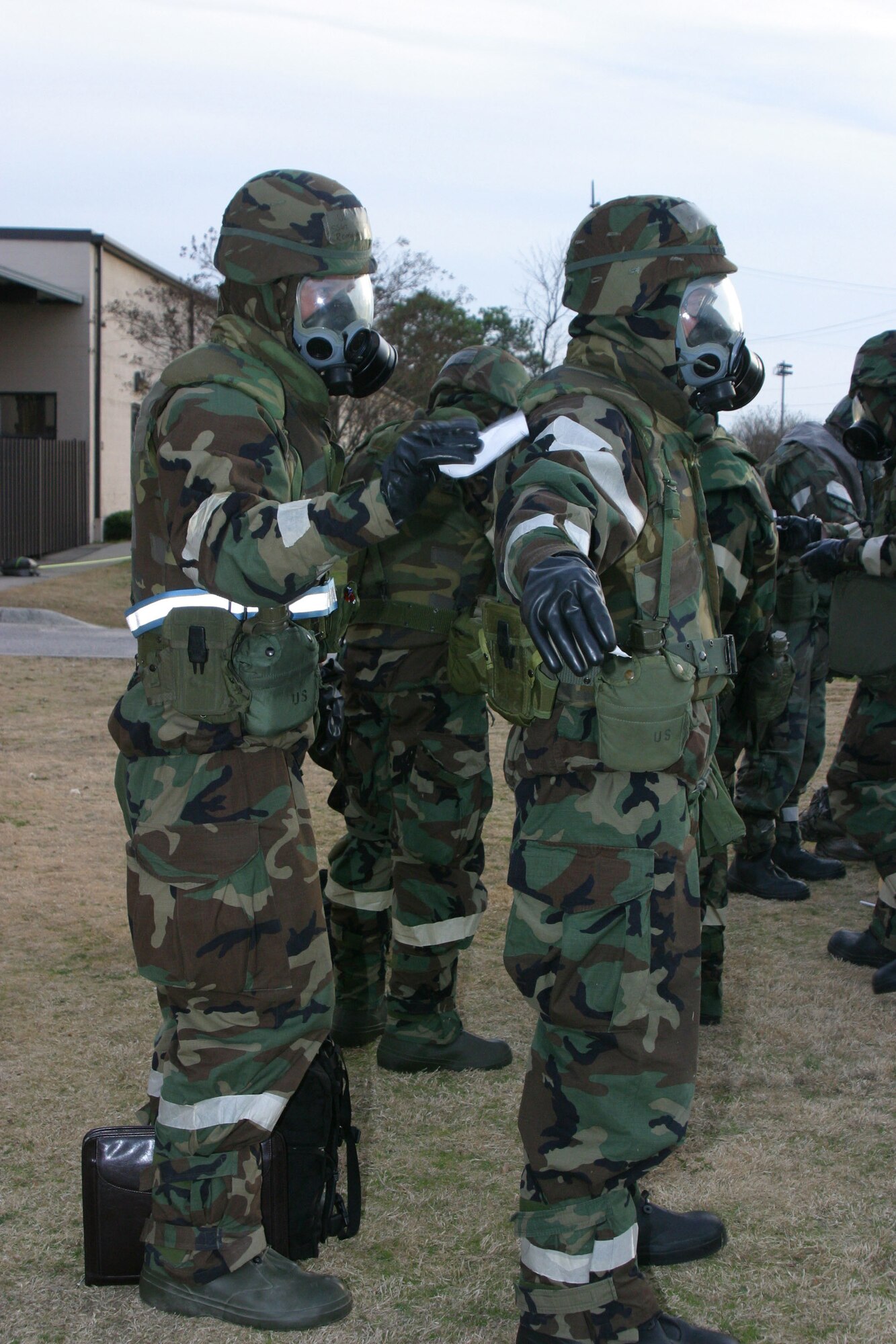 Airmen "decontaminate" each other during the Operational Readiness Exercise. This exercise was designed to prepare the base for the Unit Compliance Inspection coming up in February.