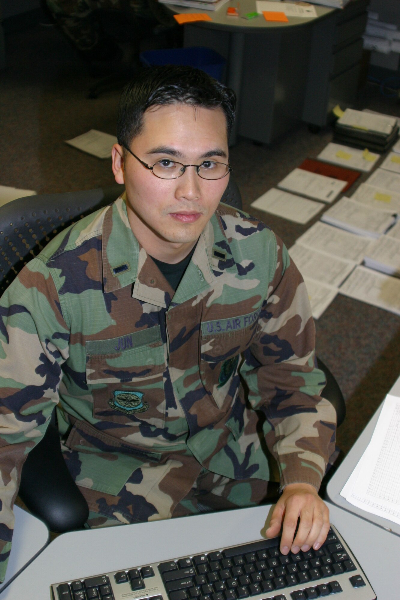 First Lieutenant Kevin Jun resolving contractual issues as he finalizes legal documentation.