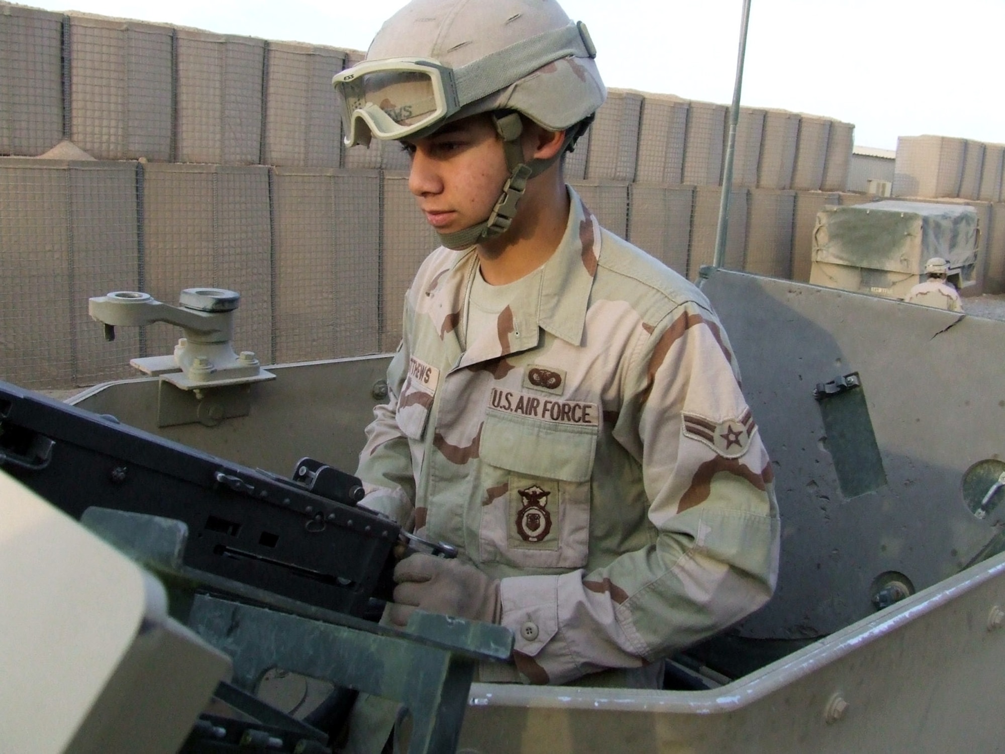 Airman 1st Class James Matthews checks his .50 caliber machine gun prior to convoy departure from Contingency Operating Base Speicher, Iraq. Deployed from the 96th Security Forces Squadron at Eglin Air Force Base, Fla., Airman Matthews is assigned to the 732nd Expeditionary Security Forces Squadron's Detachment 6. The detachment sends convoys out daily to assess the capability of Iraqi police stations in the Salah ad Din province. (U.S. Air Force photo/Maj. Richard C. Sater) 
