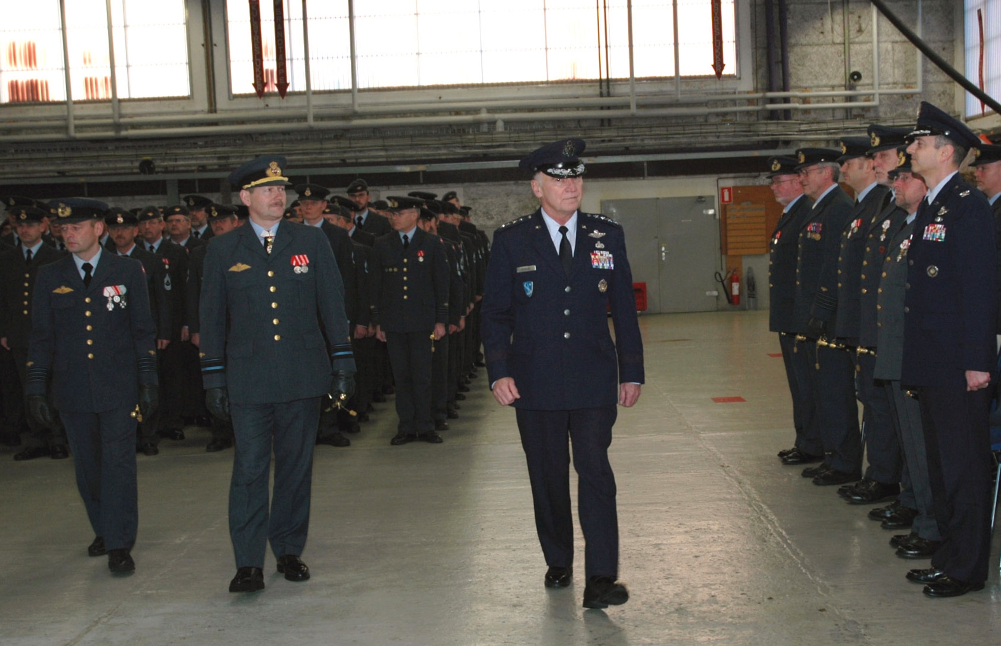 Gen. William T. Hobbins marches in an award ceremony Jan. 2 at Fighter Wing Skrydstrup, Denmark. During the ceremony, General Hobbins presented 35 U.S. Air Medals to Danish F-16 pilots who flew in support of Operation Enduring Freedom from October 2002 to October 2003. General Hobbins is the U.S. Air Forces in Europe commander. (U.S. Air Force photo/Maj. Krista Carlos)