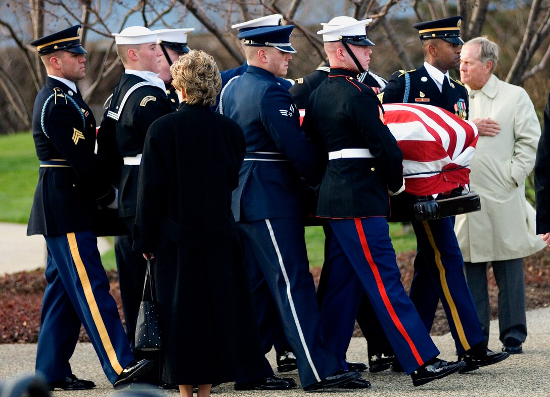 Armed Forces body bearers carry President Gerald R. Ford into the the Gerald R. Ford Presidential Library and Museum during the funeral service Jan. 2 in Grand Rapids, Mich. (U.S. Air Force photo/Tech. Sgt. Cecilio M. Ricardo Jr.) 
