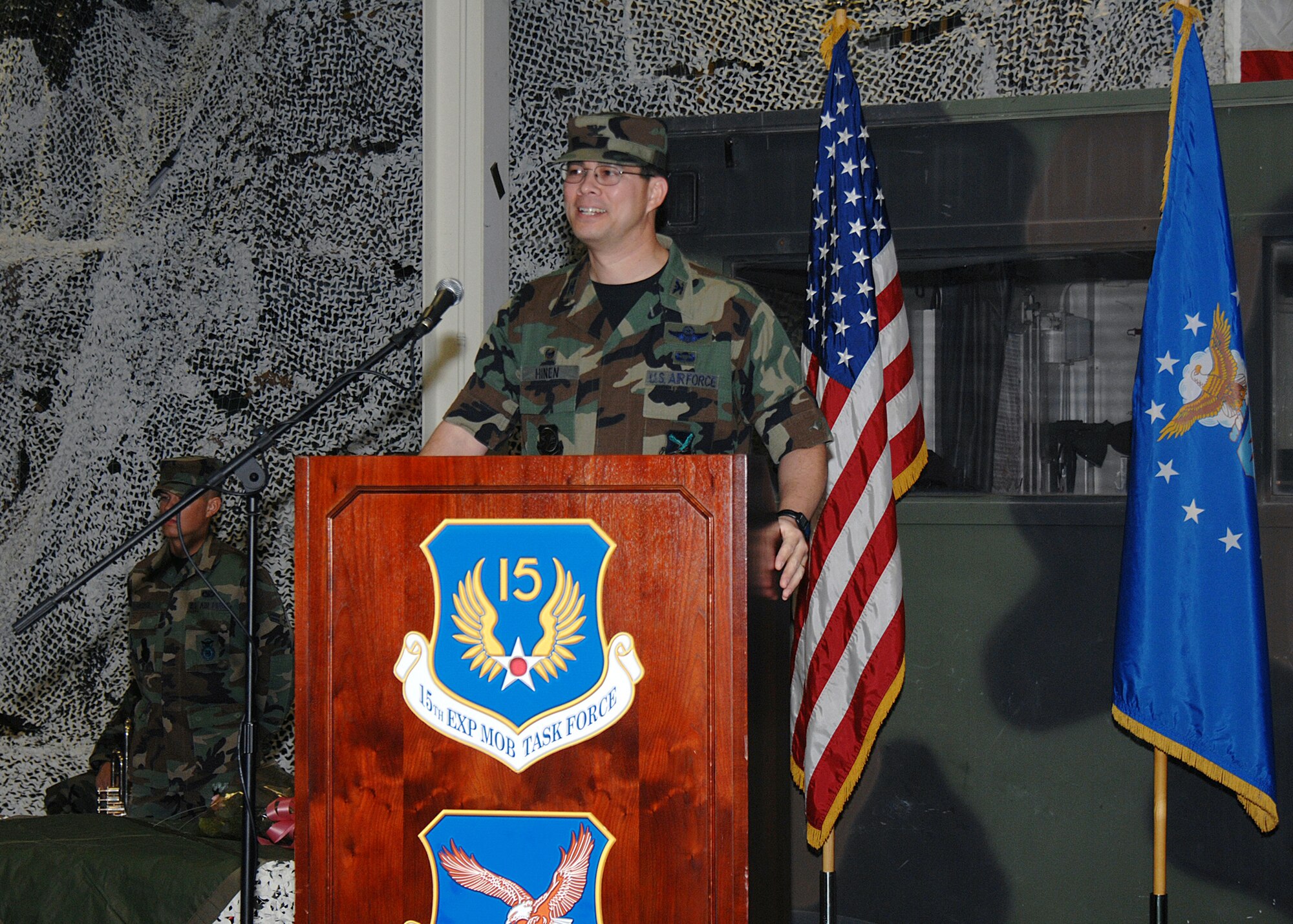 Col. Anthony Hinen, 615th Contingency Response Wing commander, addresses the audience after accepting command Dec. 19. Colonel Hinen is a command pilot with more than 3,600 hours in various aircraft including the C-17 Globemaster III aircraft. (U.S. Air Force photo by David Cushman/Visual Information)