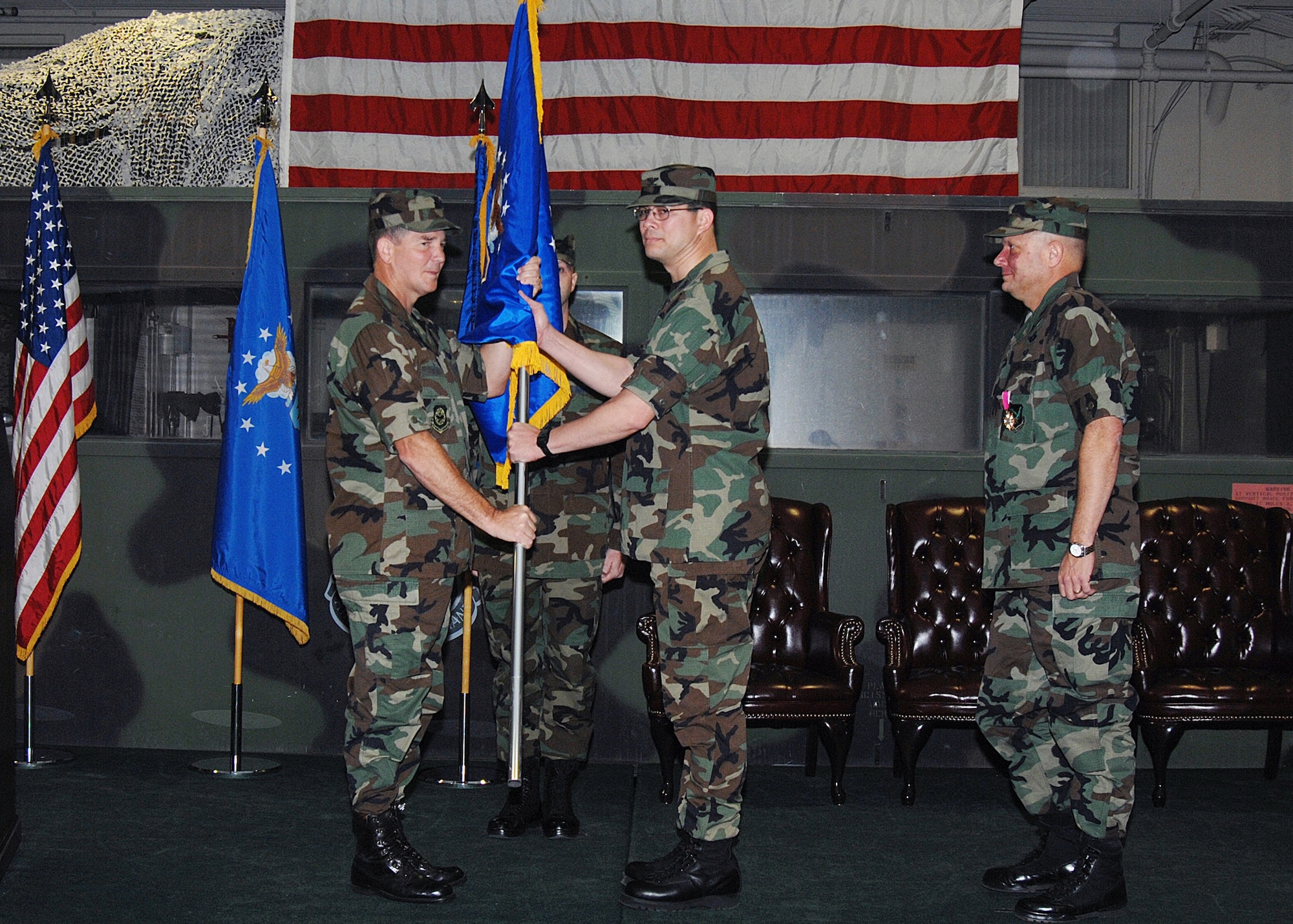 Col. Anthony Hinen accepts command of the 615th Contingency Response Wing from Brig. Gen. Mark Stearns, 15th Expeditionary Mobility Task Force commander, during a change of command ceremony Dec. 19. Colonel Hinen is the wing's second commander, replacing Col. Timothy Grosz. (U.S. Air Force photo by David Cushman/Visual Information)