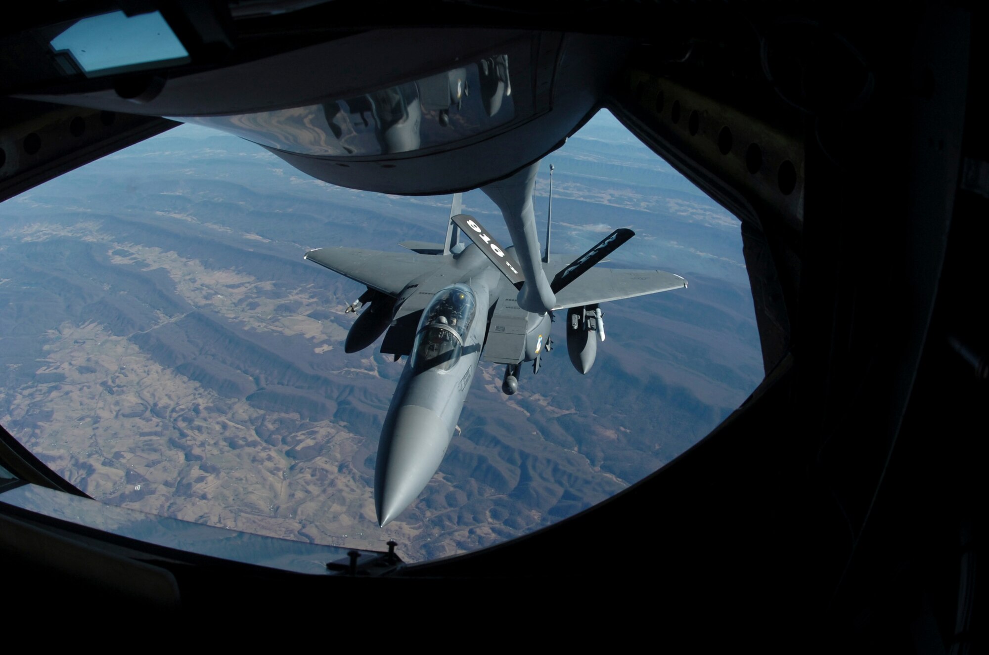 An F-15E Strike Eagle approaches a KC-135R Stratotanker for an in-flight refueling Wednesday. The Eagle was en route to take part in a 21-ship flyover for President Gerald R. Ford?s memorial service in Grand Rapids, Mich. (U.S. Air Force photo by Airman 1st Class Greg Biondo) (released)