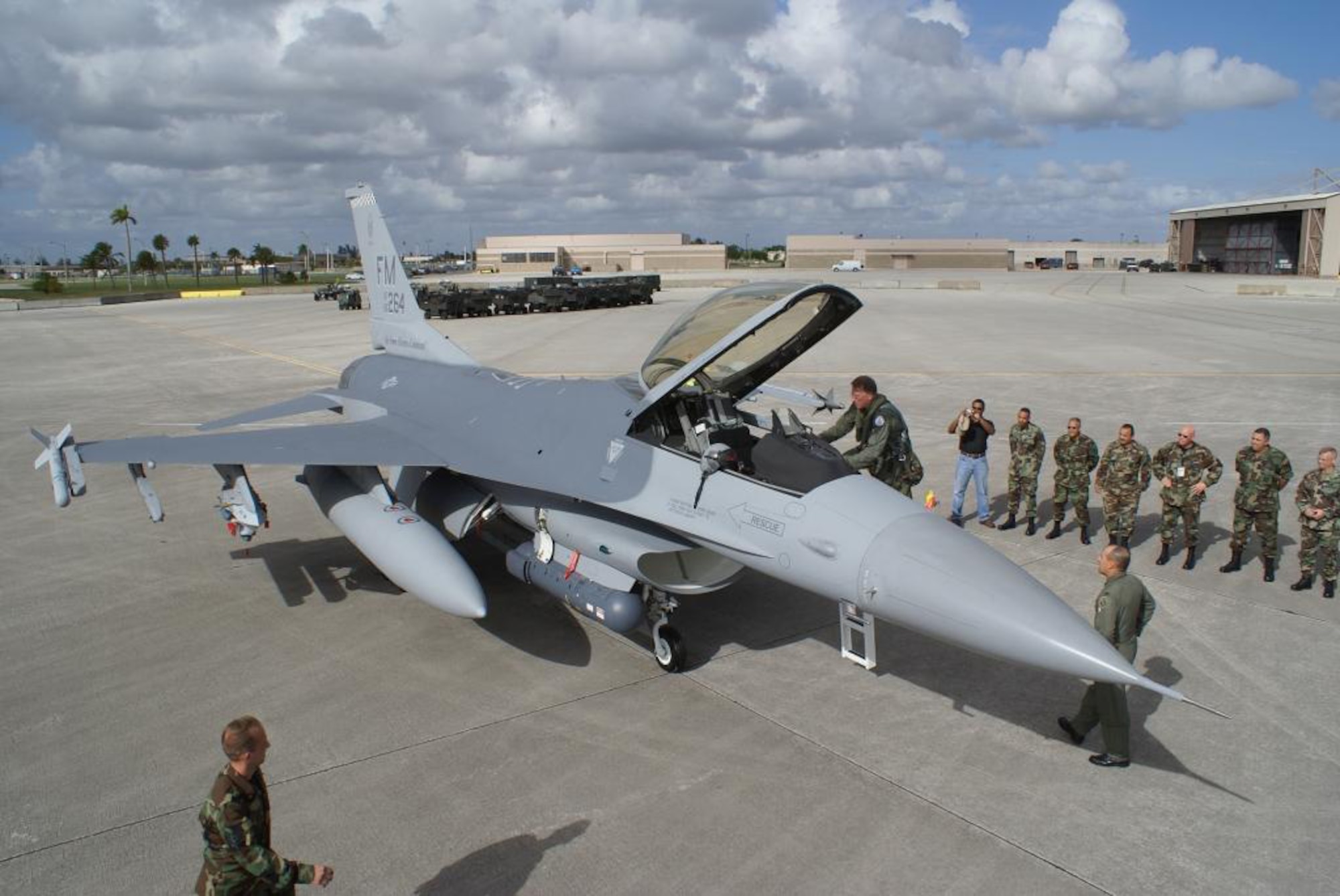 Lt. Gen. John A. Bradley, Commander of the Air Force Reserve Command, climbs into the cockpit of his newly dedicated F-16 Dec. 13 here at Homestead Air Reserve Base, Fla. 482nd Maintenance Group Airmen presented a pristine F-16 to the general and dedicated it in his honor. (U.S. Air Force photo/Ryan Ayers)