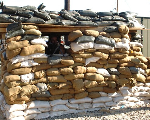 Airman Matthew Kennedy, 4th Security Forces Squadron, overlooks the entry control point to tent city stopping any unauthorized entry during an exercise Dec. 12. Security Forces is the first line of defense for the perimeter of tent city.  Security forces Airmen can use the exercise as training to prepare to support real-world deployments. (U.S. Air Force photo by Senior Airman Micky Bazaldua)(released)