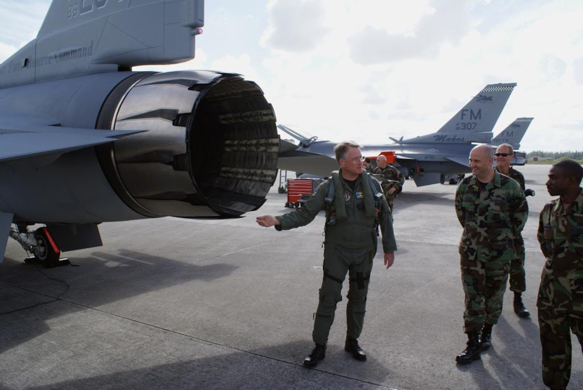 Commander of the Air Force Reserve Command, Lt. Gen John A. Bradley speaks with Airmen of the 482nd Maintenance Group about the work done on an F-16 presented to him prior to his flight Dec. 13 here at Homestead Air Reserve Base, Fla. (U.S. Air Force photo/Ryan Ayers)