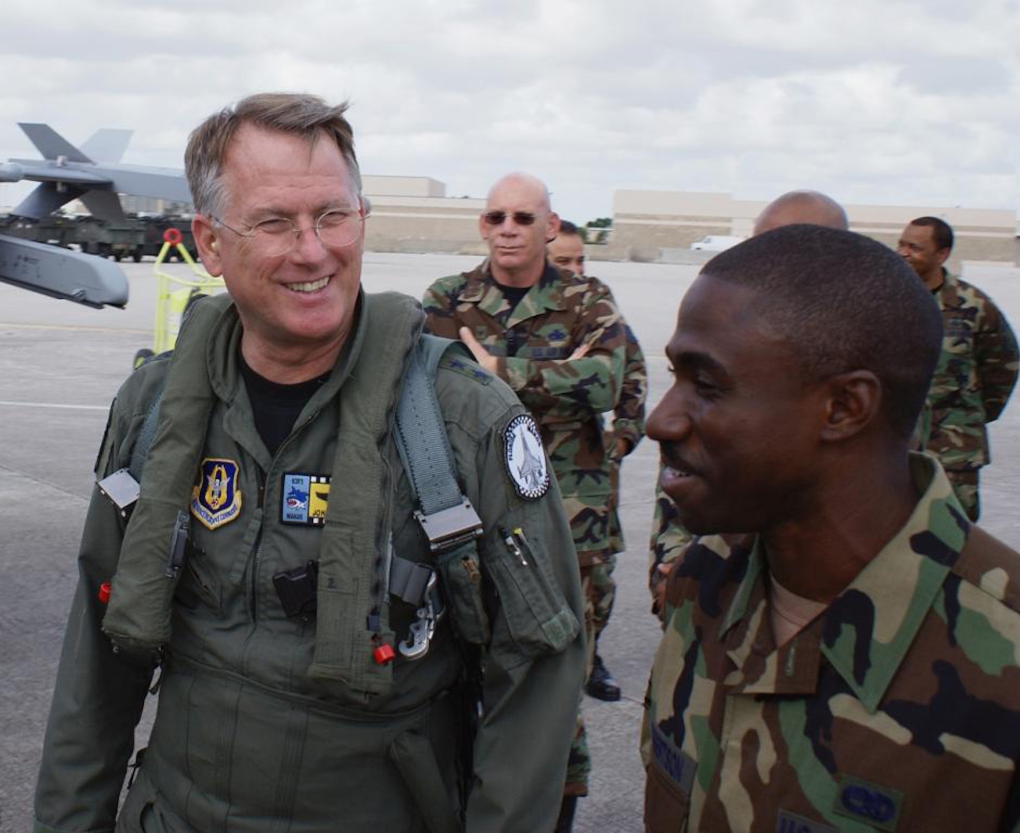 Commander of the Air Force Reserve Command, Lt. Gen. John A. Bradley thanks F-16 crew chief Staff Sgt. Johnny Robertson as he gets a close look at the “spruced-up” jet that the Airmen of the 482nd Maintenance Group dedicated to him. The general said that he was overwhelmed and touched by the honor. (U.S. Air Force photo/Ryan Ayers)