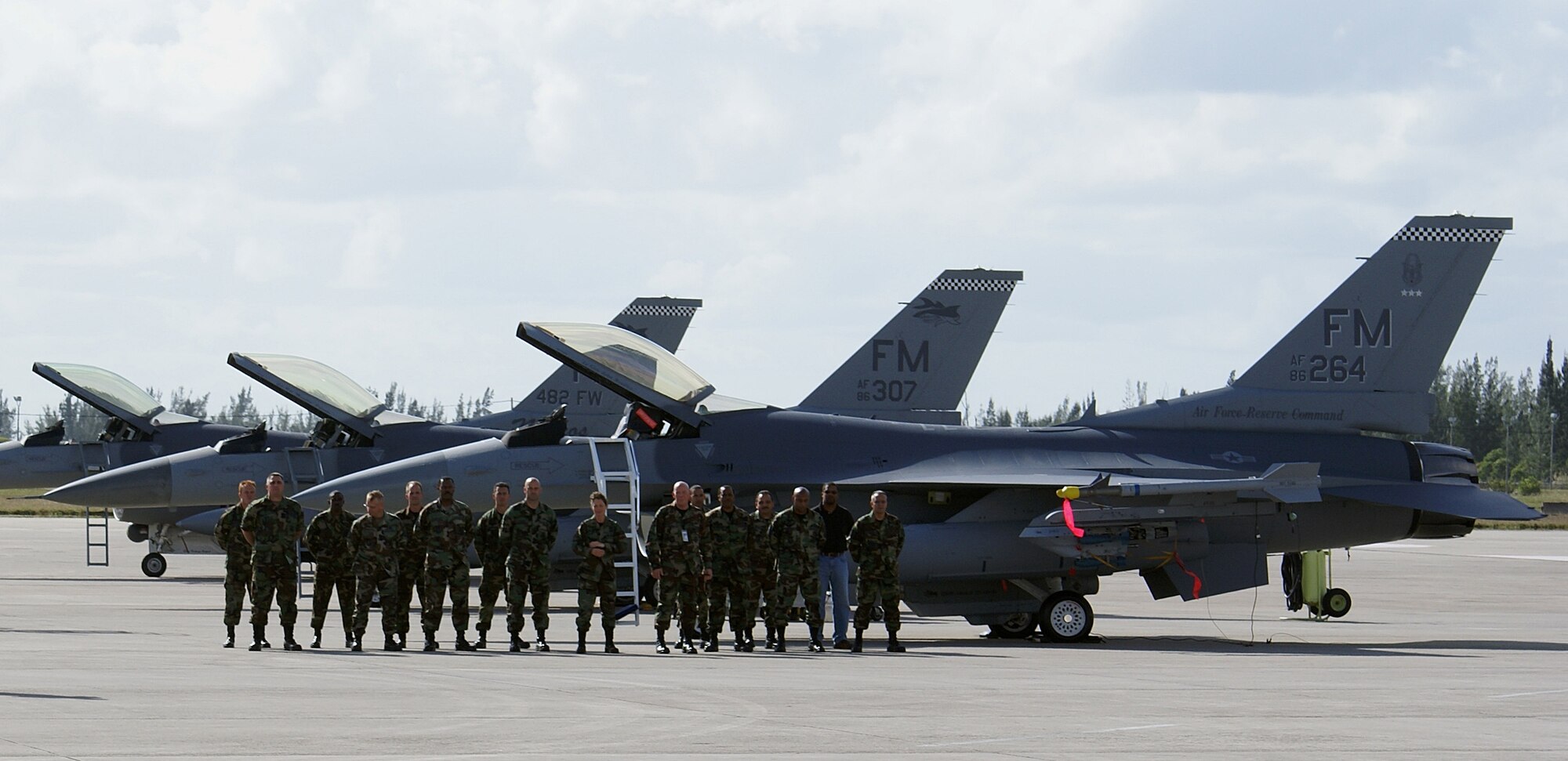 Members of the 482nd Maintenance Group and 482nd Aircraft Maintenance Squadron wait for the arrival of Lt. Gen. John A. Bradley, Commander of the Air Force Reserve Command and Chief of the Air Force Reserve Dec. 13 here at Homestead Air Reserve Base, Fla. The Airmen worked tirelessly to present and dedicate an F-16 in his honor. (U.S. Air Force photo/Ryan Ayers)