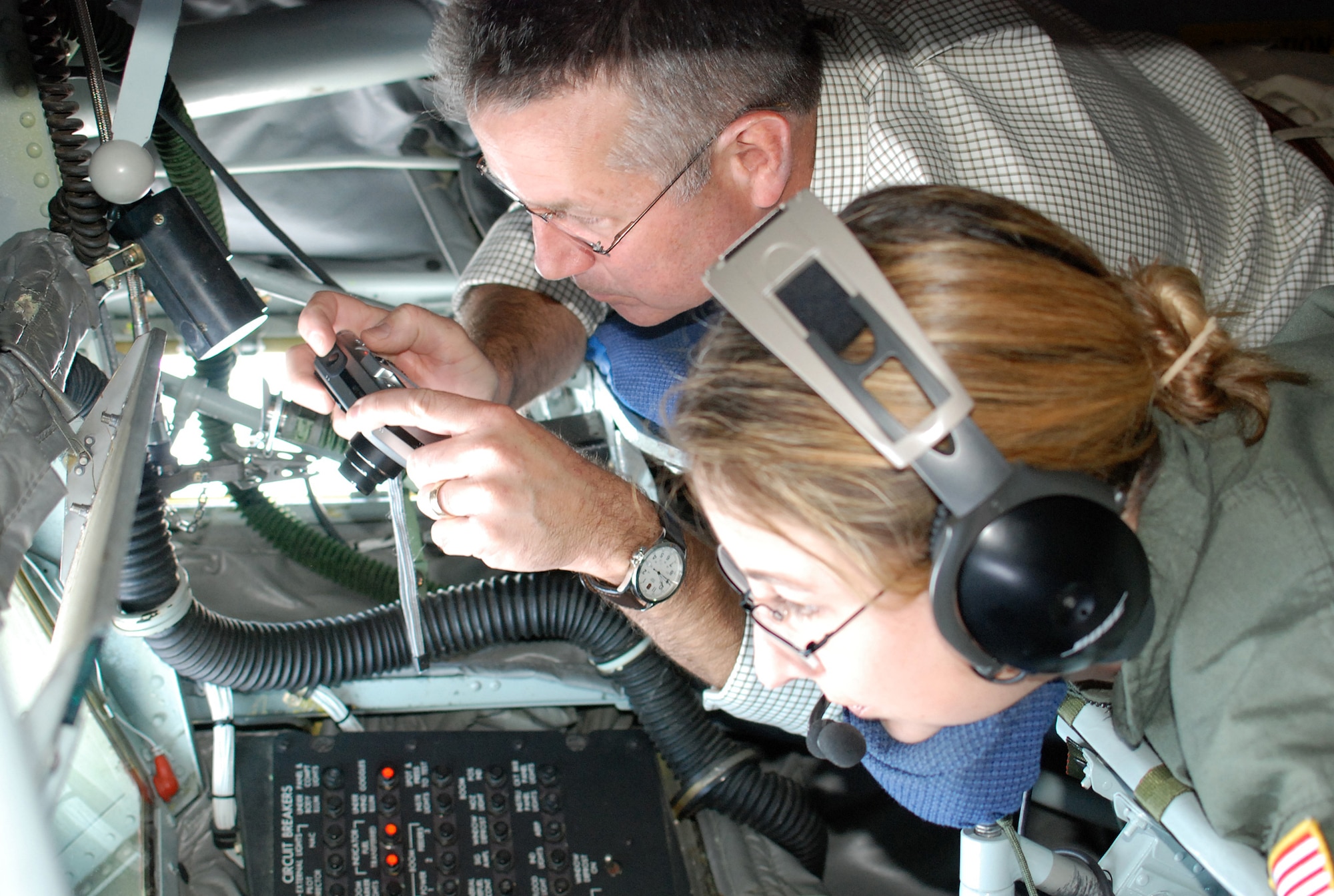 Scott Turnage, North Richland Hills, Texas city councilman, captures the moment of an Air Force Reserve Command F-16 midair refueling from a KC-135 tanker boom seat. Thirty Dallas/Fort Worth civic leaders toured Eglin Air Force Base and Patrick AFB, Fla., to learn about the Total Force mission. (U.S. Air Force Photo/Tech. Sgt. Julie Briden-Garcia)