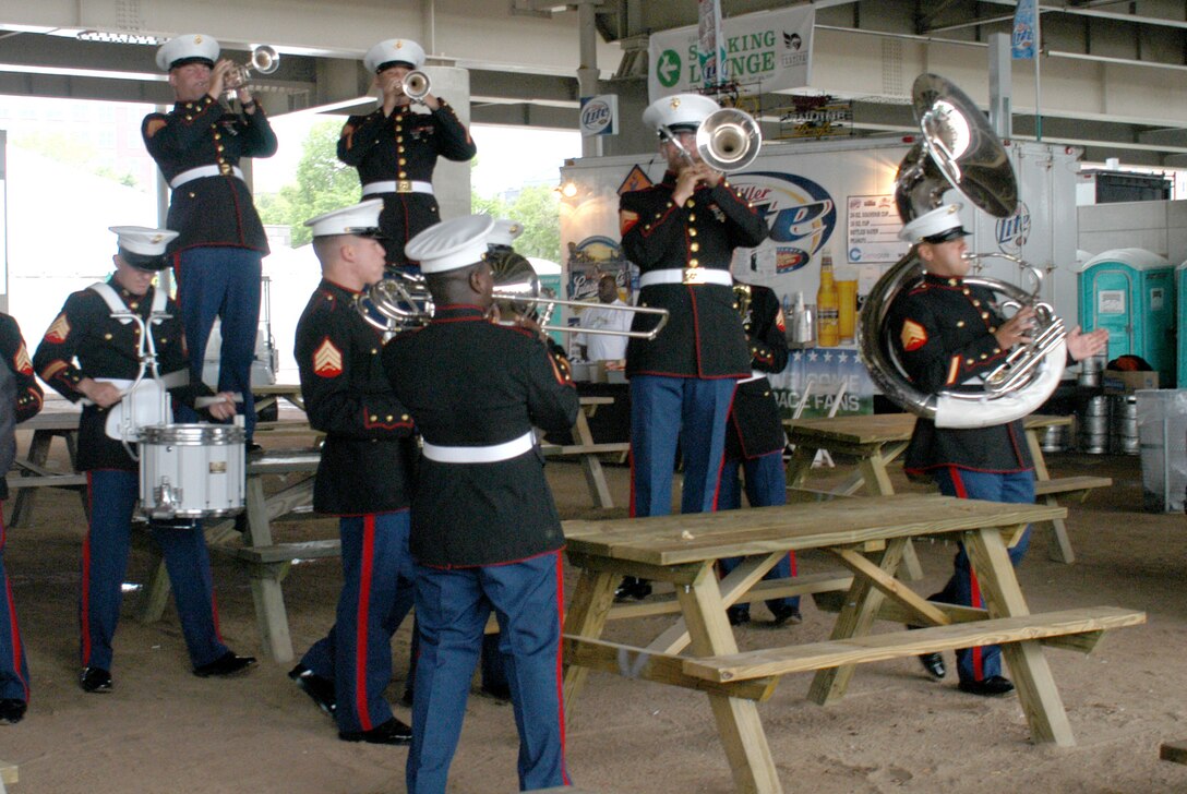 Marines from the Parris Island Marine Band combo ensemble serve as a roving band at the Chow Wagon at the Waterfront Park outdoors concert May 4. The concert, which was one of the events leading to the 133rd Kentucky Derby, was an opportunity for the Marines on the band to mingle with spectators.