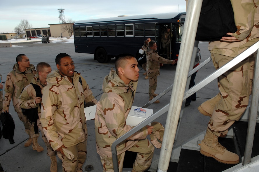 MINOT AIR FORCE BASE, N.D.  -- Team Minot Airmen board a plane here before leaving for a forward- deployed location Jan. 5 for Air and Space Expeditionary Force 5/6. The 23 Airmen leaving are deploying for 120 days and are scheduled to return in the spring. (U.S. Air Force photo by Airman 1st Class Christopher Boitz)