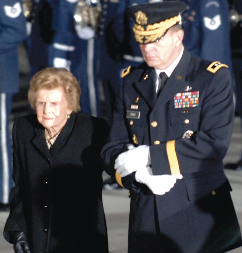 ANDREWS AFB, Md. -- Former First Lady Betty Ford is escorted by Maj. Gen. Guy C. Swan III, Joint Task Force National Capital Region and the U.S. Army Military District of Washington commanding general, as the remains of President Gerald R. Ford arrives in his casket at Andrews as part of the national farewell funeral procession honoring the former commander-in-chief.
(U.S. Air Force photo by Tech. Sgt Craig Clapper) 
