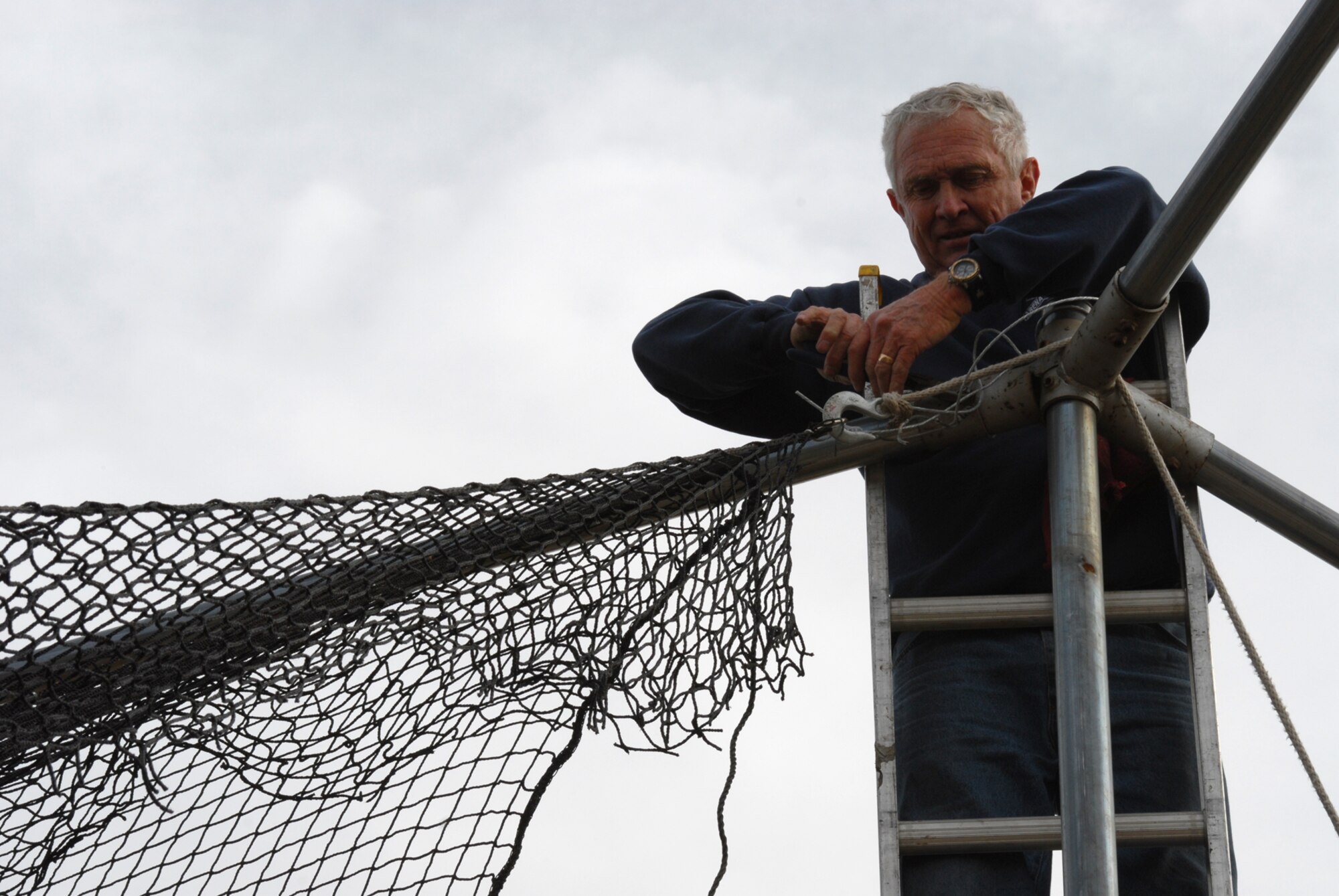 Dave Kent installs new netting for the base batting cages as part of a renovation project. This is the first major renovation to the batting cages since their installation in 1998. The rejuvenation of the batting cages falls in line with youth baseball and softball season registration, which begins Jan. 29. For more information on the youth baseball/softball season or registering, call the Youth Center at 987-6355.