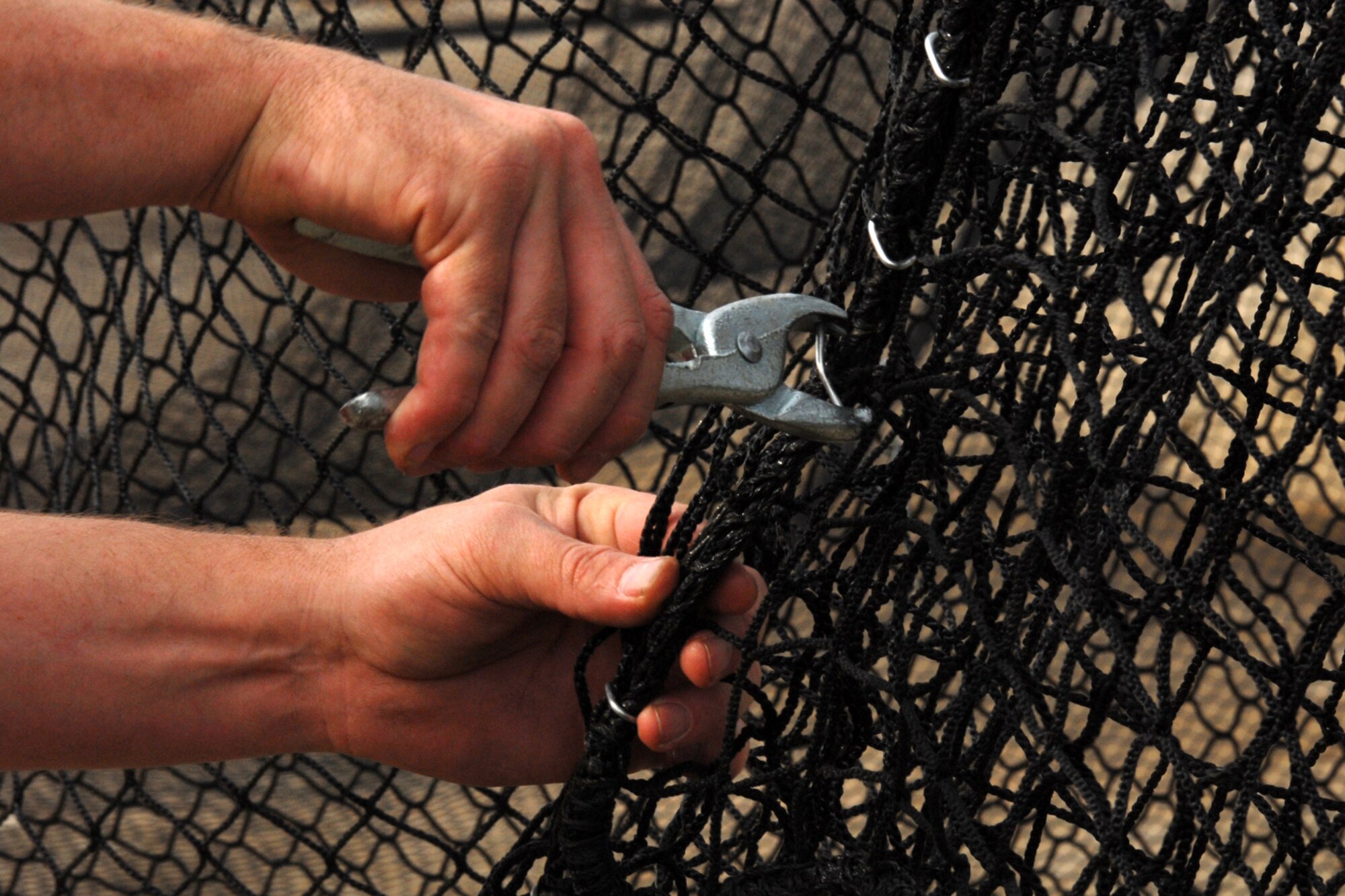 Dave Kent installs new netting for the base batting cages as part of a renovation project. This is the first major renovation to the batting cages since their installation in 1998. The rejuvenation of the batting cages falls in line with youth baseball and softball season registration, which begins Jan. 29. For more information on the youth baseball/softball season or registering, call the Youth Center at 987-6355.