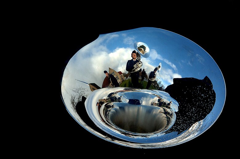 Rehearsal for the funeral of Gerald R. Ford in Grand Rapids, Mich., is reflected in the bell of a sousaphone. (U.S. Air Force photo illustration/Tech. Sgt. Jeremy T. Lock)





