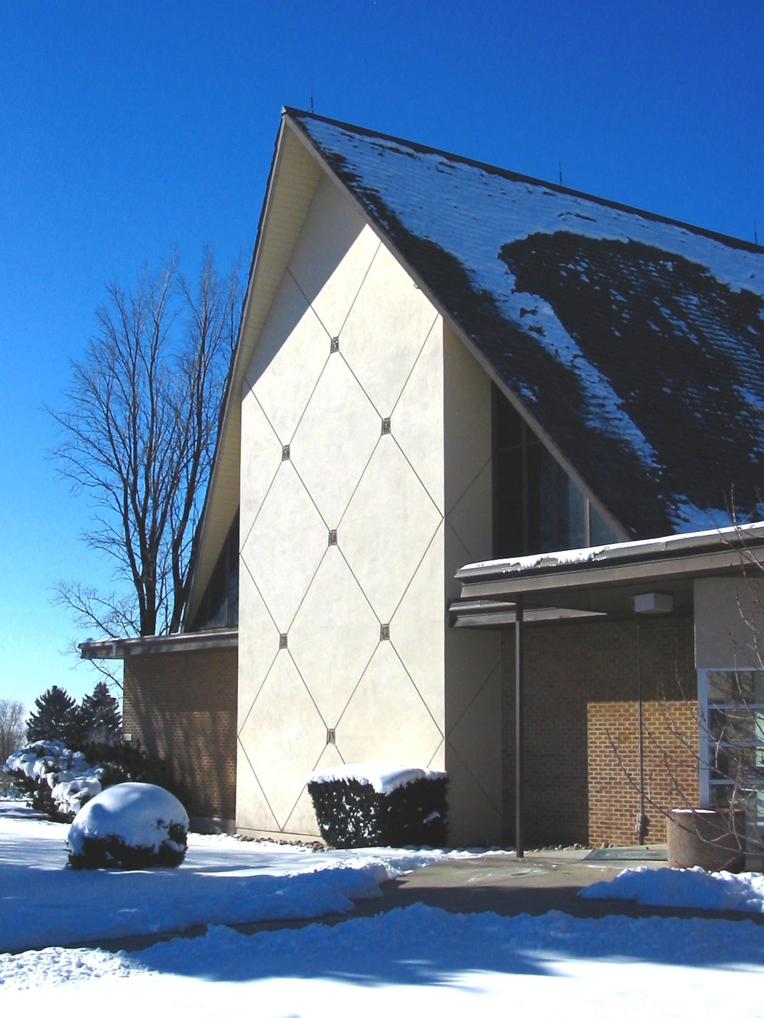 Chapel front covered with snow.