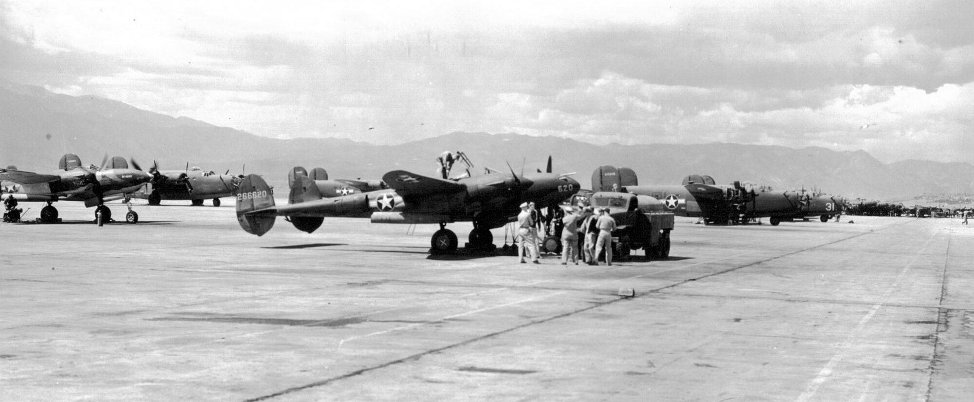 With the Rocky Mountains in the background, aircraft fill the ramp at Peterson Army Air Field in 1943. These are F-4s and F-7s, the photo reconnaissance versions of the P-38 Lightning fighter and B-24 Liberator bomber. (Photo courtesy Peterson Air and Space Museum.) 