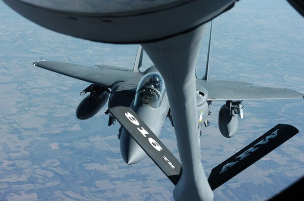 Members of the 916th Air Refueling Wing, Air Force Reserve, refuel their 4th Fighter Wing counterparts over Michigan skies on Wednesday afternoon as part of President Gerald Ford's funeral. Twenty-one F-15 Fighting Falcons and three KC-135 Stratotankers based at Seymour Johnson Air Force Base, N.C. took part in the final ceremonies to honor a veteran and their former commander-in-chief. (U.S. Air Force photo by A1C Greg Biondo)(released)