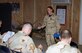 BALAD AIR BASE, Iraq -- Staff Sgt. Channa Johnson, 332nd Expeditionary Mission Support Group PERSCO team member, briefs Airmen upon their arrival to Balad Air Base, Jan. 2. Sergeant Johnson is deployed from Charleston Air Force Base, S.C. (U.S. Air Force photo by Staff Sgt. Alice Moore)                                 