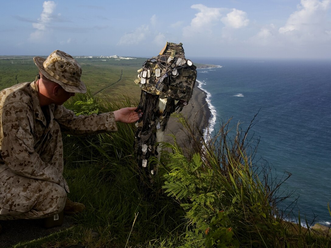 Marines of Mike Company, 3rd Recruit Training Battalion, show off tools of the trade they use for combat fitness training.
