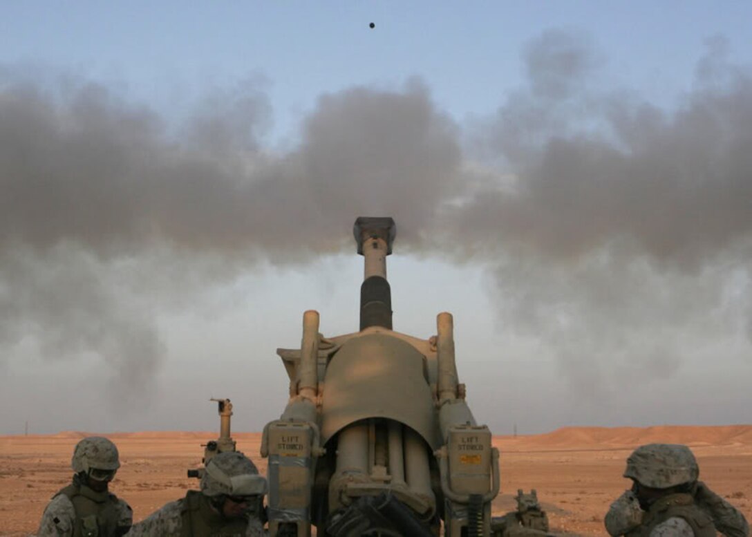 U.S. Marines with Lima Battery, 3rd Battalion, 12th Marine Regiment, 3rd Marine Division fire a howitzer outside Camp Al Asad, Iraq, Jan. 6, 2007. (U.S. Marine Corps photo by Lance Cpl. Tyler W. Hill)