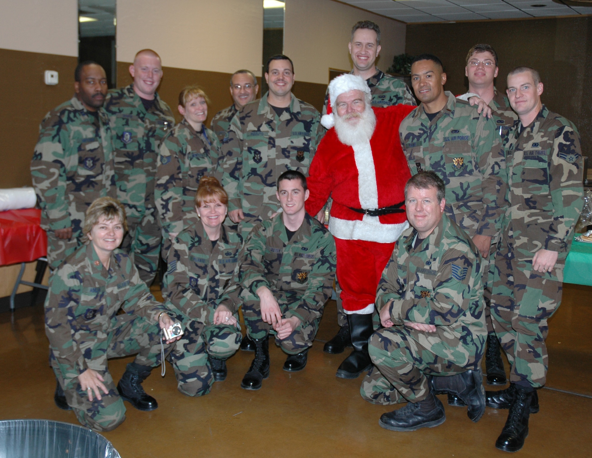 Members of the 944th Fighter Wing pose for a photo during the annual holiday kick off celebration at the American Italian Club in Phoenix on Dec. 2. Thirteen members of the wing visited with about 200 clients of the Valley of the Sun Habilitation School, an event the wing has participated in for more than 20 years. (U.S. Air Force photo/Tech. Sgt. Barbara Plante)