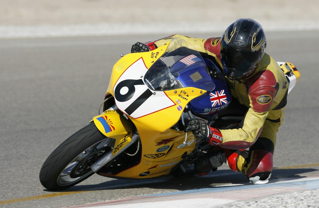 Chief Master Sgt. Wayne Nielsen, 944th Maintenance Squadron munitions systems flight chief, races down the track while competing in the Championship Cup Series. Chief Nielsen placed second overall this year, beating 100 other racing enthusiasts. (Photo by Mike LaPutt)