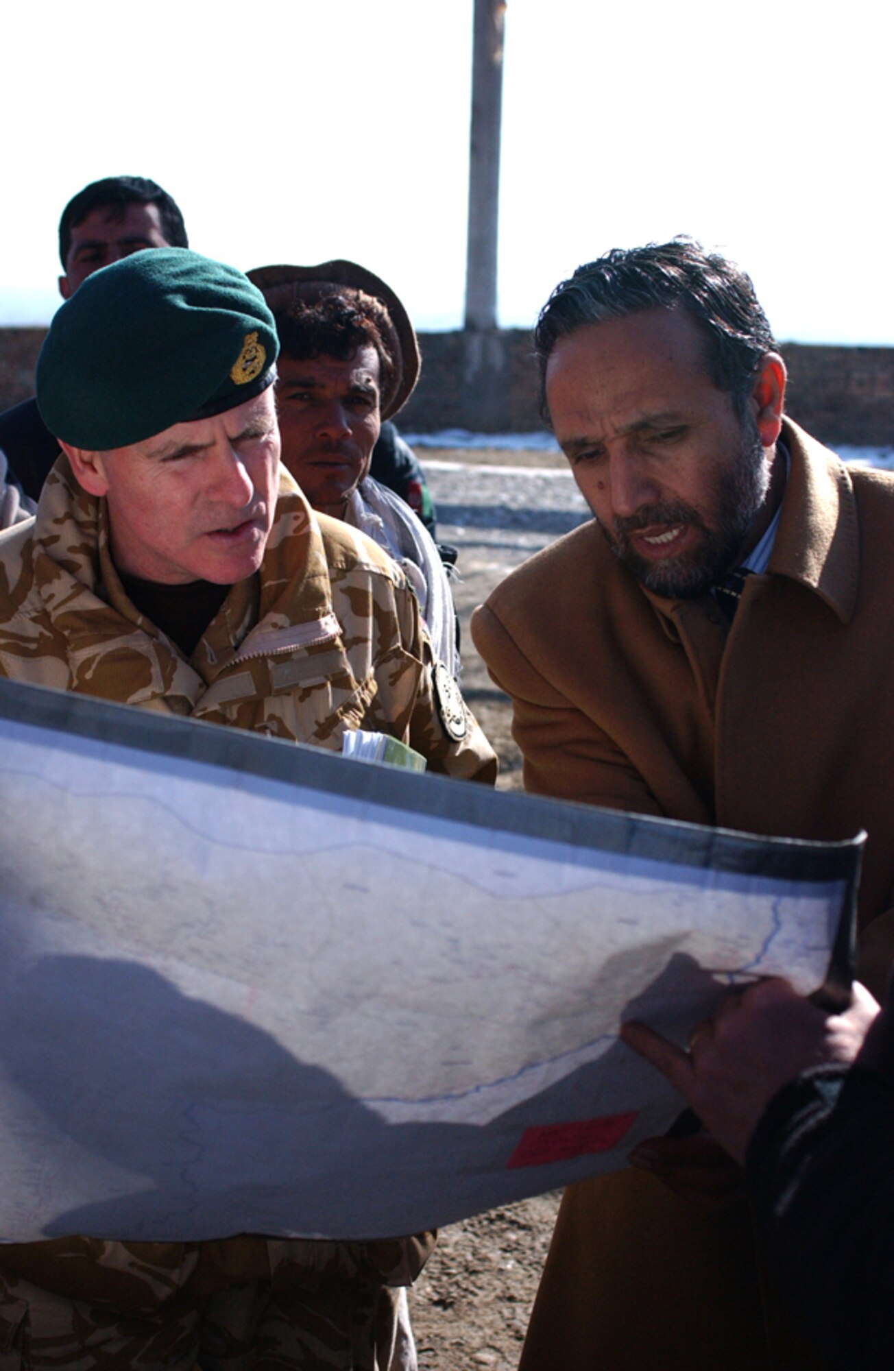 British Maj. Gen. Garry Robison, ISAF Deputy Commander of Stability, and Governor Abdul Sattar Murad of the Kapisa Province discuss future plans and on-going operations in the Kapisa Province Jan. 4. (U.S. Army photo/Spc. Josh LeCappelain)                              