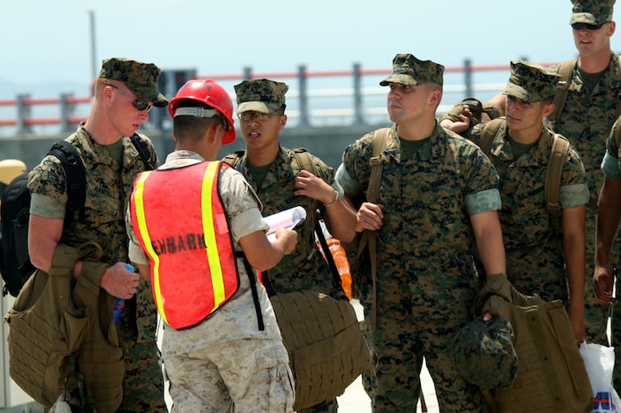 Marines from Marine Wing Support Squadron 171 confirm their permission to board the High Speed Vessel, taking them on a 24-hour ride to Camp Pohang, Korea for exercise Ulchi Focus Lens 2007.