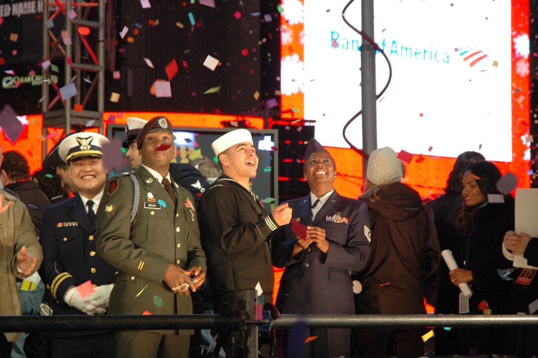 Tech. Sgt. Sonya Bulluck, Aerial Port Specialist with the Air Force Reserve Command's 514th Air Mobility Wing, McGuire Air Force Base, N.J., rings in the New Year in style in Times Square, New York City. She was selected as an honoree of New York Mayor Michael R. Bloomberg and joined nine other service members from all branches of the military to help Mayor Bloomberg push the button to drop the ball at midnight. Festivities included numerous media interviews as well as a live interview on the Carson Daly show, NBC. (U.S. Air Force photo/Senior Airman Rachel Bernardes) 