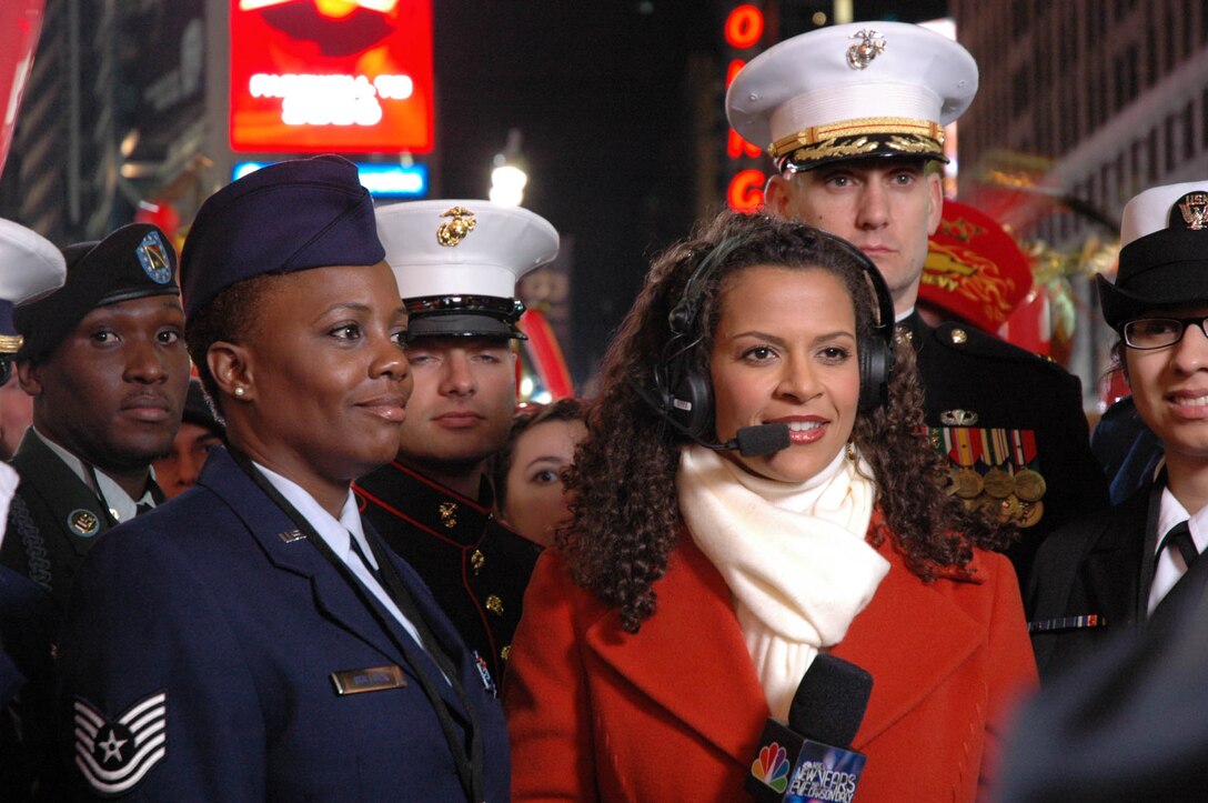 Tech. Sgt. Sonya Bulluck, Aerial Port Specialist with the Air Force Reserve Command's 514th Air Mobility Wing, McGuire Air Force Base, N.J., rings in the New Year in style in Times Square, New York City. She was selected as an honoree of New York Mayor Michael R. Bloomberg and joined nine other service members from all branches of the military to help Mayor Bloomberg push the button to drop the ball at midnight. Festivities included numerous media interviews as well as a live interview on the Carson Daly show, NBC. (U.S. Air Force photo/Senior Airman Rachel Bernardes) 
